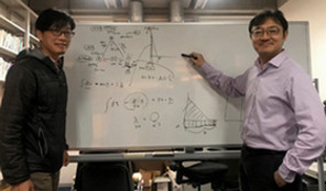 yihsu by whiteboard with math calculations